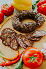 Antipasti and catering platter with different meat and cheese products. Various mixed meat and vegetable appetizers . Europe dinner food (German name is Brettljause).
