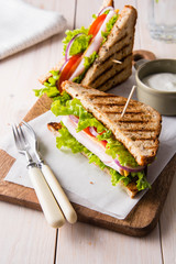 Sandwich with meat, fresh salad and vegetables.
