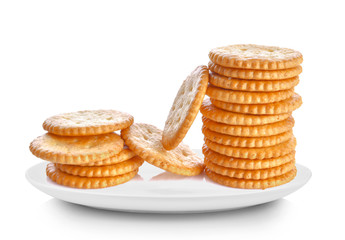 crackers in white plate on white background