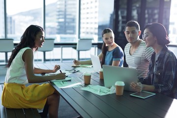 Executives working together in office