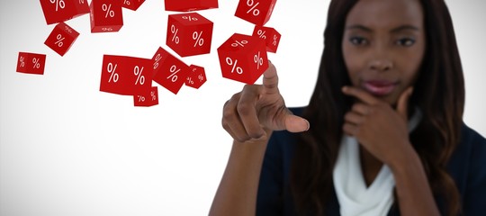 Composite image of businesswoman with hand on chin using