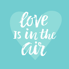 Obraz premium Love Is In The Air Valentines day card with hand drawn brush lettering