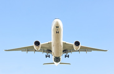 large passenger jet in a clear blue sky