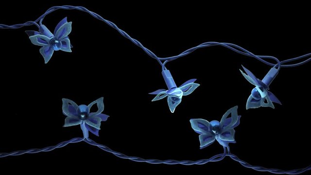 blinking new year christmas blue batterfly garland isolated on black background. 2 fragment of 5 lights.