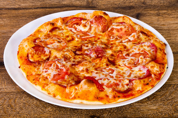 Pepperoni pizza with sausages
