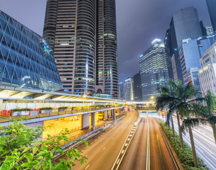 Hong Kong at night with city street and modern buildings