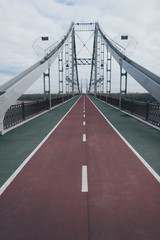empty pedestrian bridge on cloudy autumn day