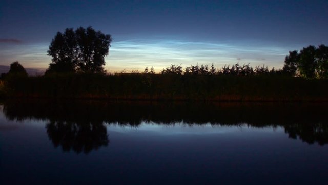 noctilucent clouds NLC over Noordhollandsch Kanaal canal summer evening twilight timelapse