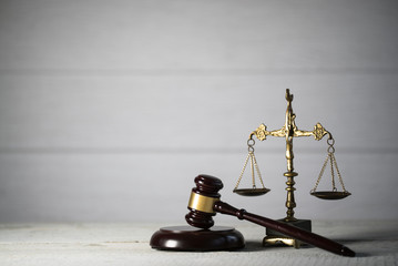 Law and Justice concept. Mallet of the judge,  Gray background, place for typography. Courtroom theme.