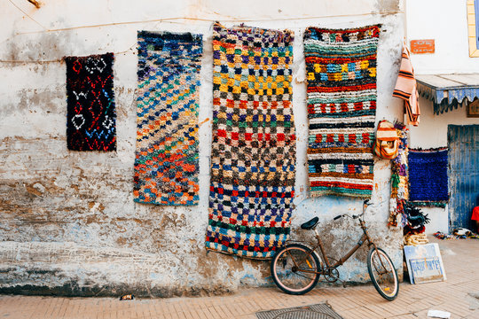 rusty bicycle standing at wall of marrakech souk