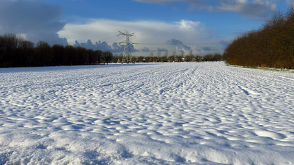 Obraz premium Winter Landscape With Residential Houses in the Background