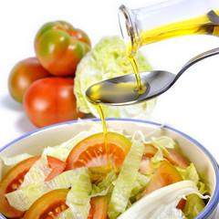 Tomato and vegetable salad dressed with olive oil