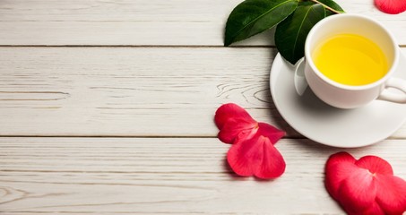 Cup of herbal tea on table