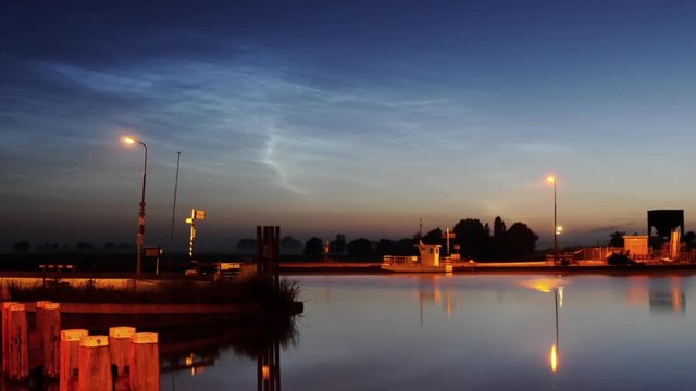 noctilucent clouds NLC over Noordhollandsch Kanaal canal summer twilight timelapse ZOOM IN