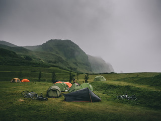 magnificent landscape with mountains and tents in camping, Iceland - obrazy, fototapety, plakaty