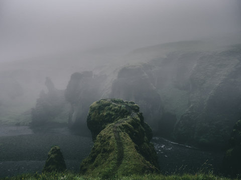 green foggy cliffs in Western Fjords in Iceland