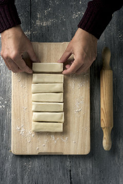 man preparing meat stuffed cannelloni