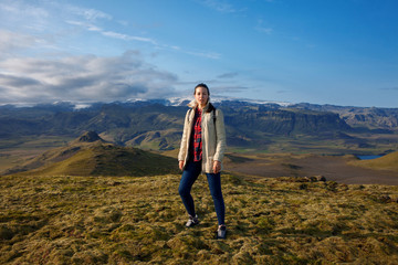 Obraz premium Attractive girl tourist on background of mountain landscape