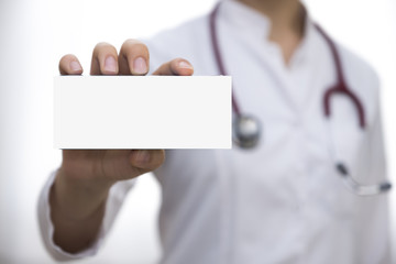 Doctor is showing and holding a white empty blank medicine box template or paper