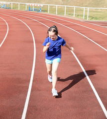 Fototapeta premium Little girl have fun on the stadium