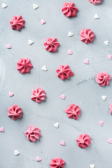 Fototapeta premium Valentines day holiday love concept with pink meringue and hearts
