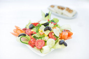 Fresh vegetable meditteranean greek salad with cucumber parsley and black olives