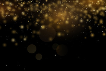 Golden sparkles in black background