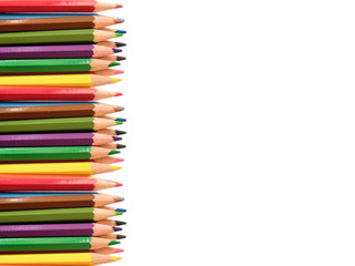 Isolated multi colored paint pencils align left 