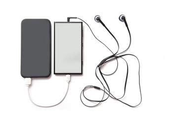 Black power bank and smartphone © Ruslan Zagidullin