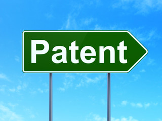 Law concept: Patent on green road highway sign, clear blue sky background, 3D rendering