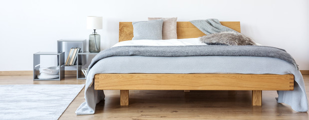 Simple grey bedroom with lamp