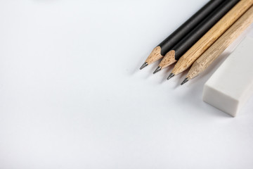 Obraz premium sharp pencil with eraser on blank paper