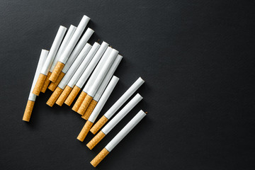 Cigarettes on a dark background.