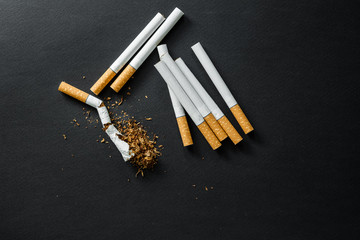 Broken cigarette on a dark background. quit Smoking