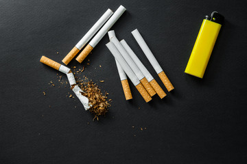 Broken cigarette on a dark background. quit Smoking