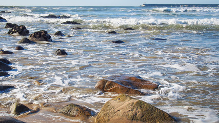 Boulders in Atlantic Ocean surf at Porto, Portugal