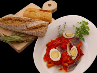 tray with peppers salad and kitchen board with bread