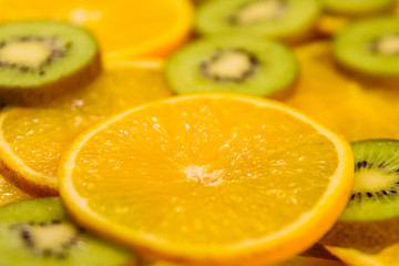 Background of the kiwi and orange fruits. Selective focus
