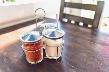 Caddy of Thai Condiments Consisting of Ground Dried Chilli Pepper and Sugar