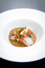 gourmet fusion cuisine squid with pickled vegetables in pumpkin curry