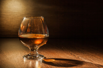 Cognac drinks glass on dark background