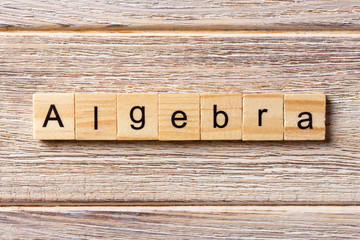 Algebra word written on wood block. Algebra text on table, concept