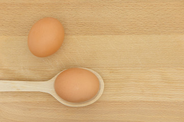chicken eggs on a wooden background