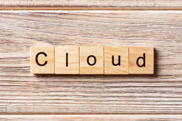 cloud word written on wood block. cloud text on table, concept