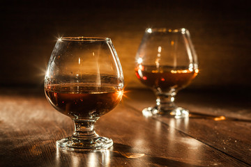 Cognac drinks glass on dark background