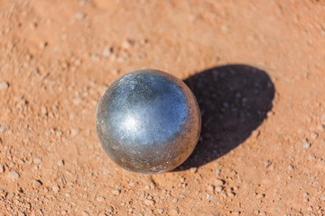 Fototapeta na wymiar Petanque ball on the ground