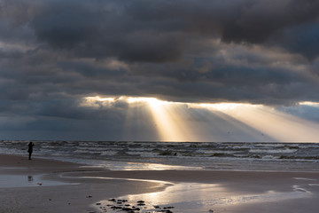 Sun beams in stormy sky, Baltic sea, Latvia.