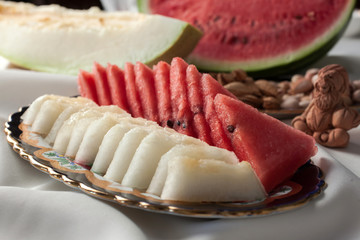 Watermelon and melon slices on a platter.