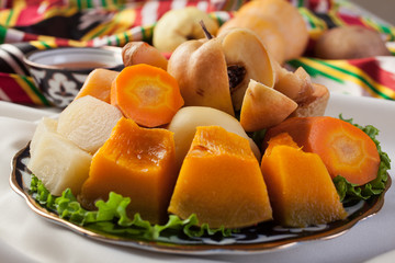Cold vegetables.Pumpkin, carrots, turnips, quince on the plate.