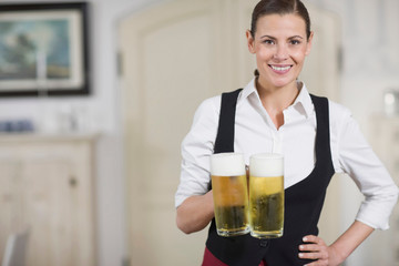 Waitress carrying beer